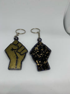 fist bronze with transparent black with gold flakes